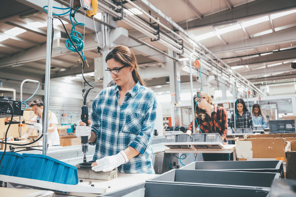 Image of woman working in a machining lab